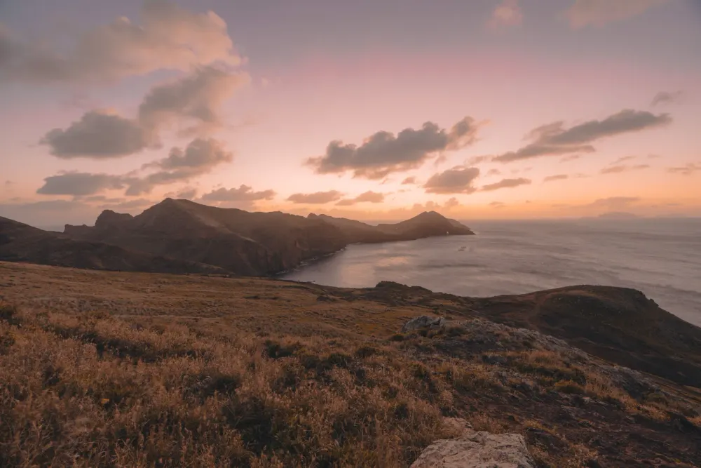 The dry, ochre Ponta de São Lourenço peninsula at sunrise, seen from above Baía d'Abra, Madeira