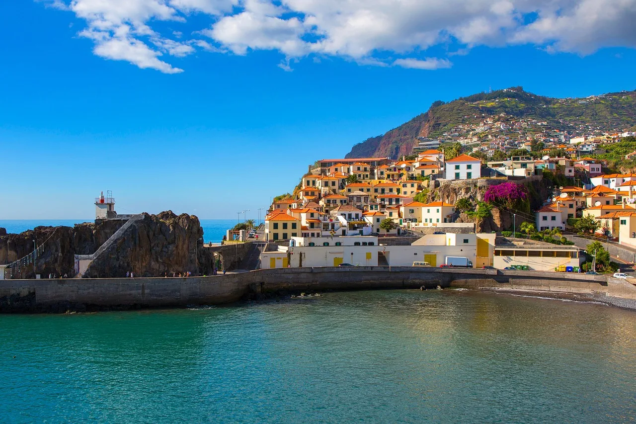 The fishing harbour and terracotta-roofed hillside village of Câmara de Lobos, Madeira